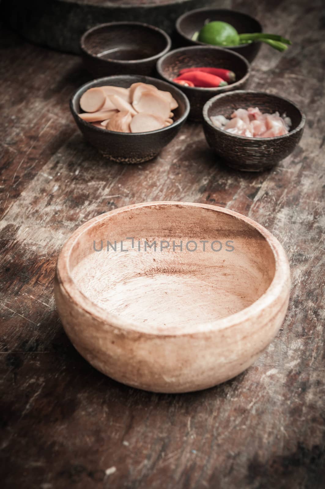 closeup of empty wood bowl on wooden floor by sayhmog