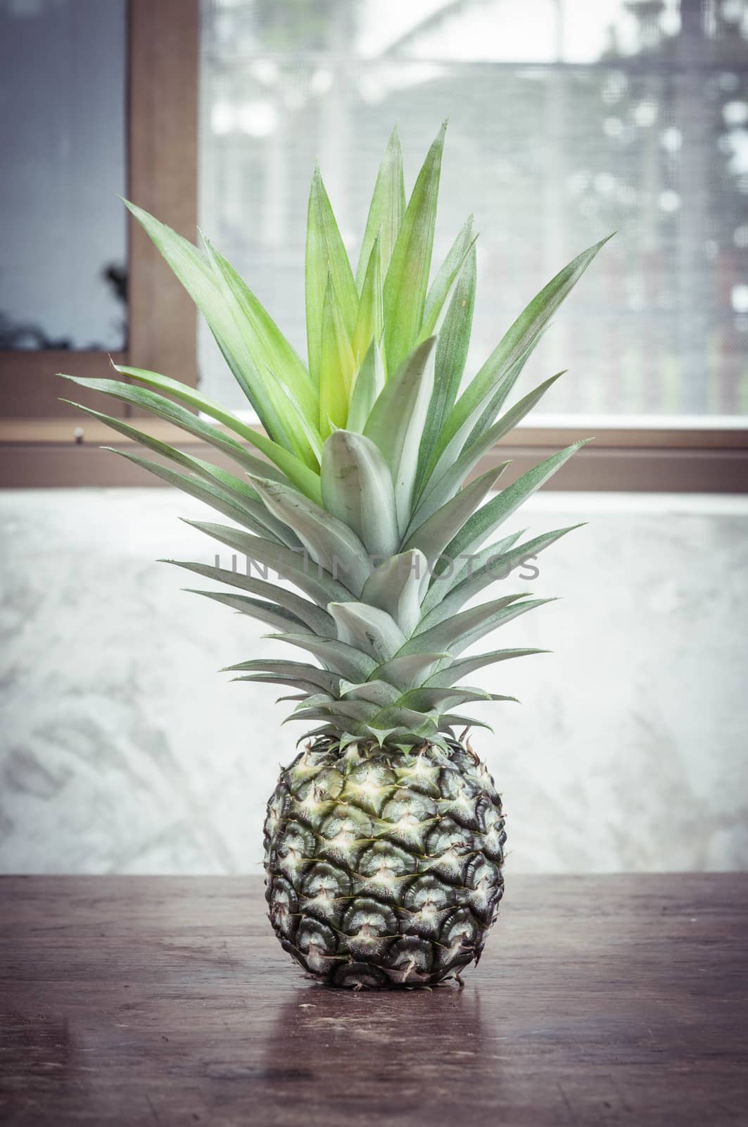 pineapple on wood table closeup