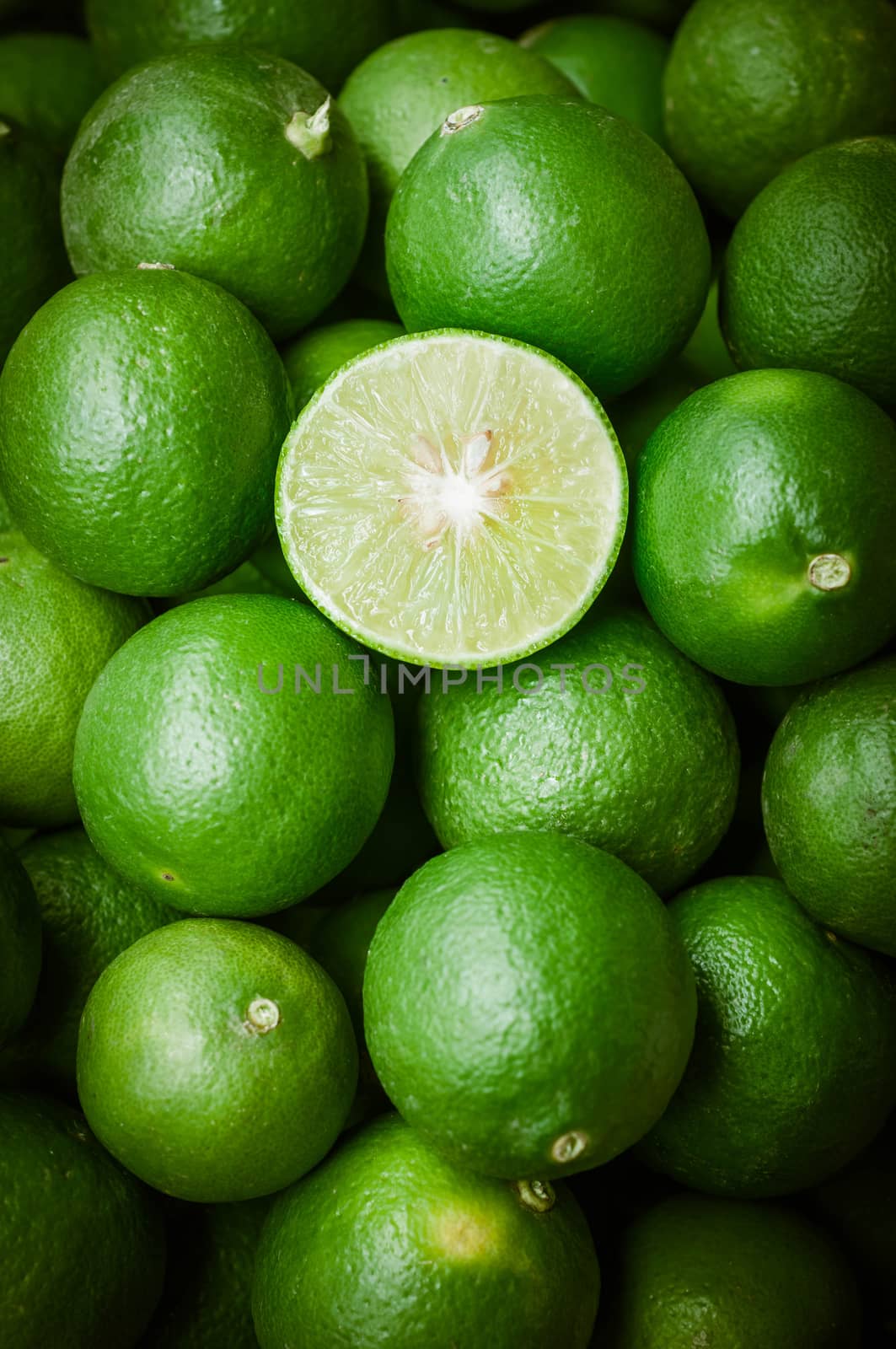 Still life of green lemon cut