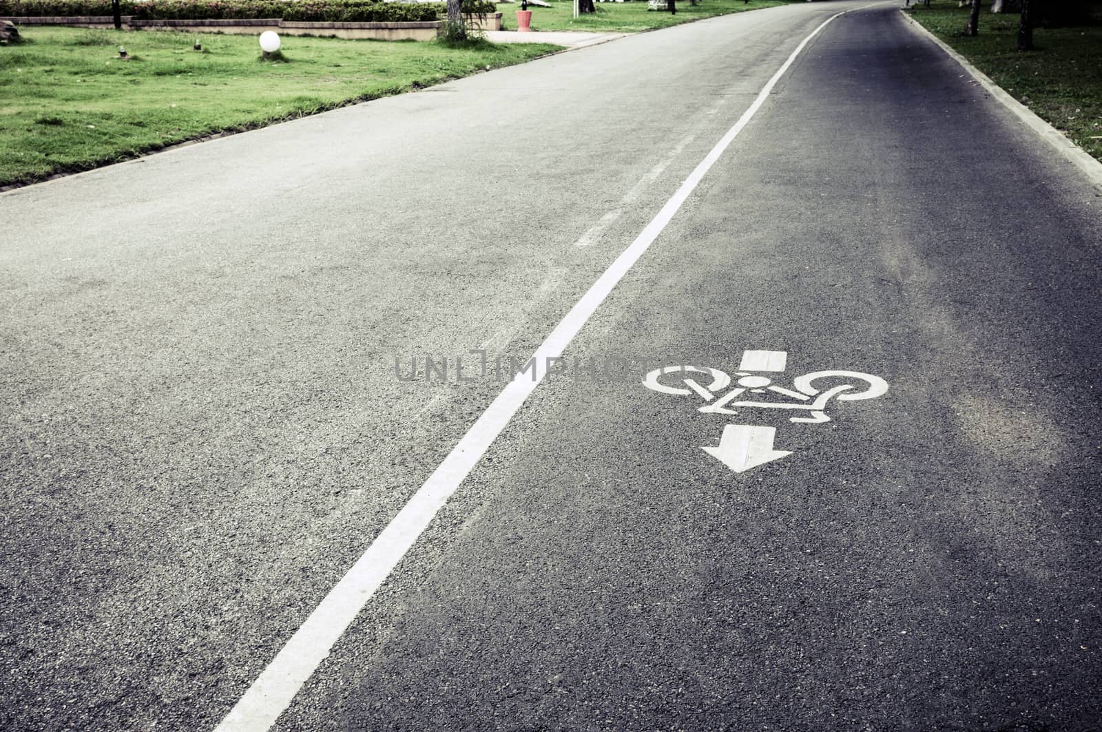 bicycle lane sign on the road