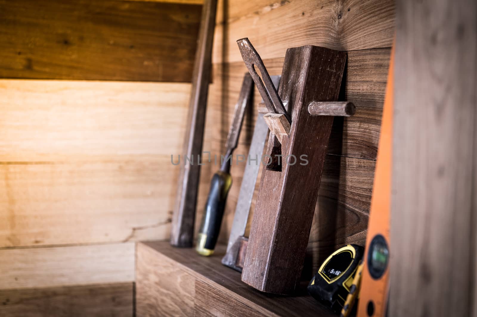 closeup of planer tool on wood shelf