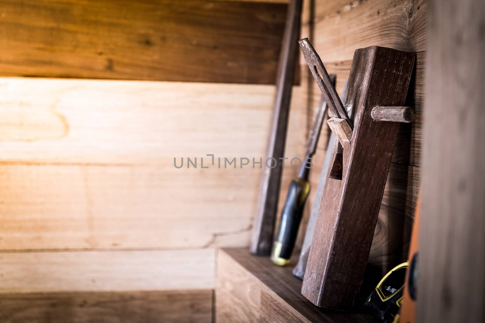 closeup of planer tool on wood shelf