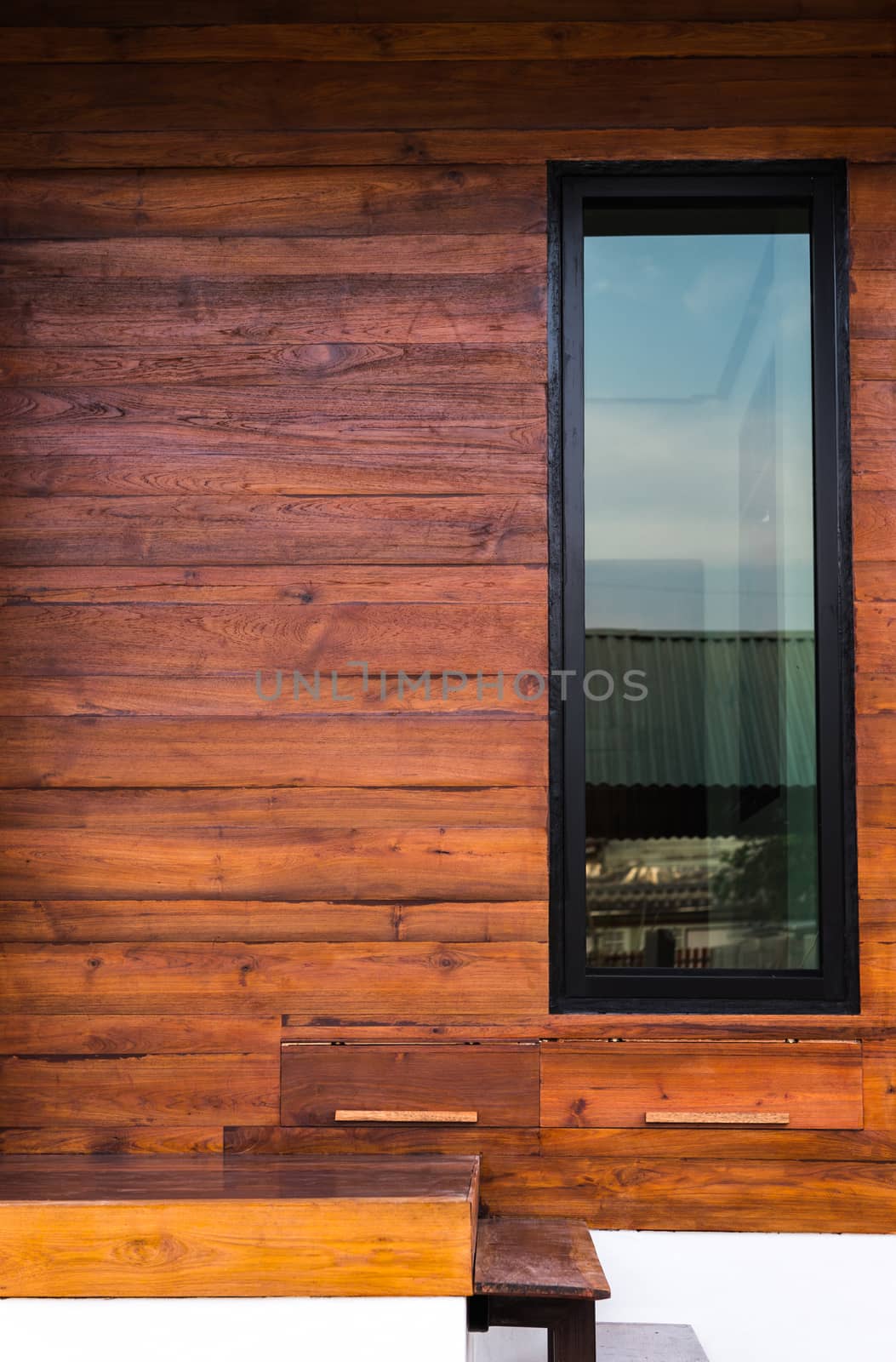 glass window and wood wall