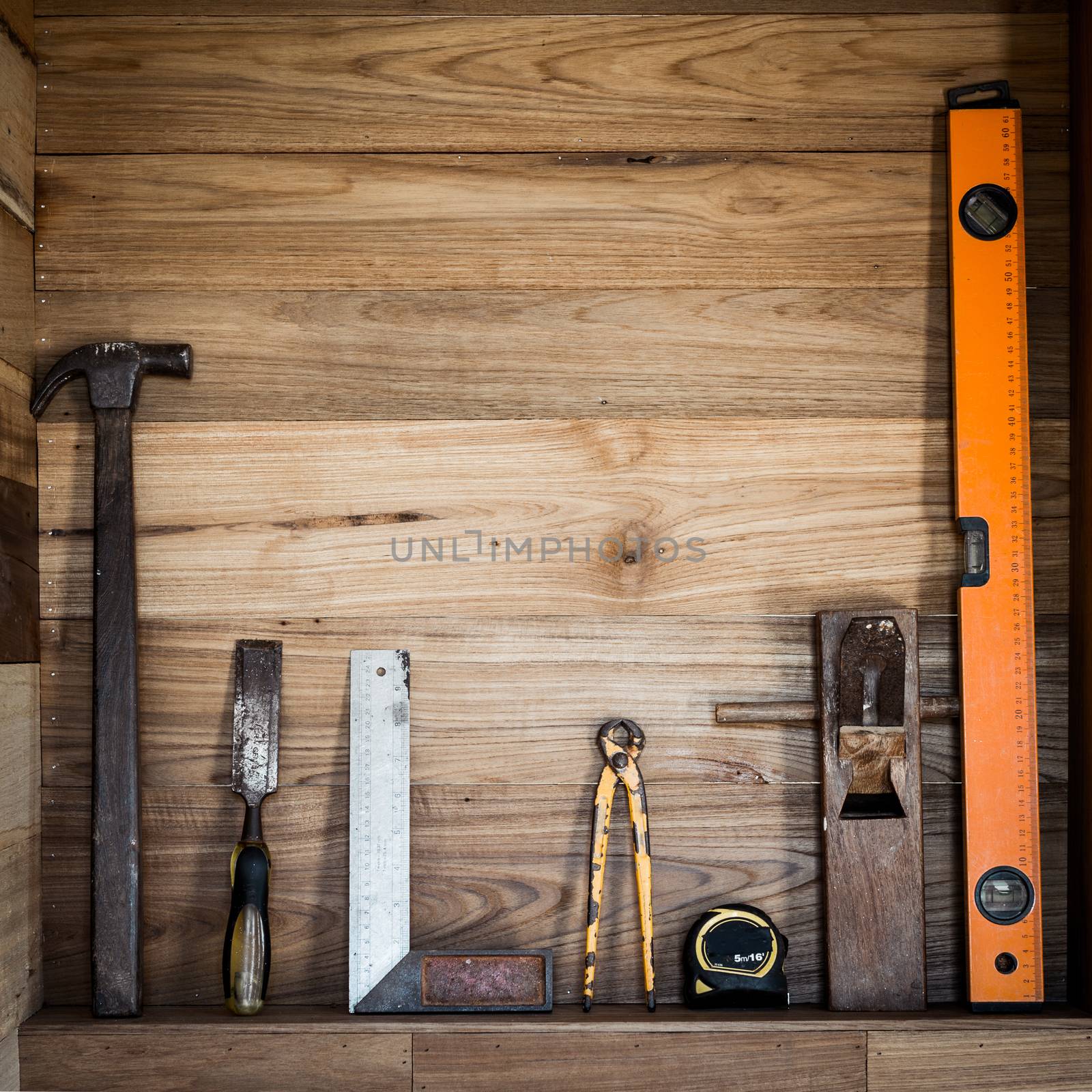 Closeup of working tool and wood background