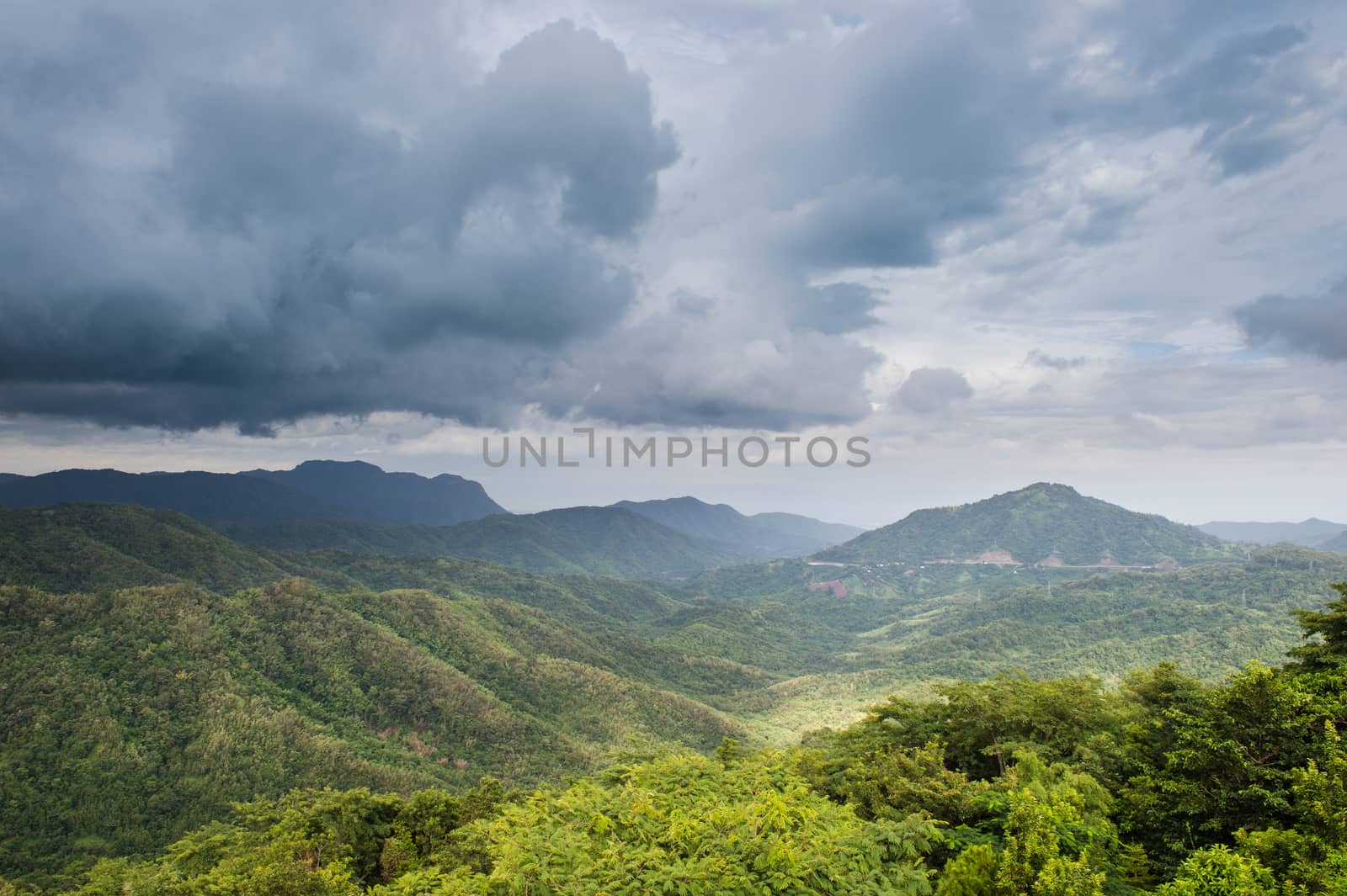 Landscape of mountain green forest and clouds sky