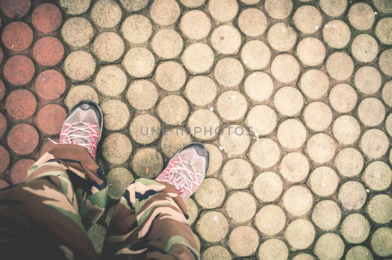 Closeup of shoes and brick floor