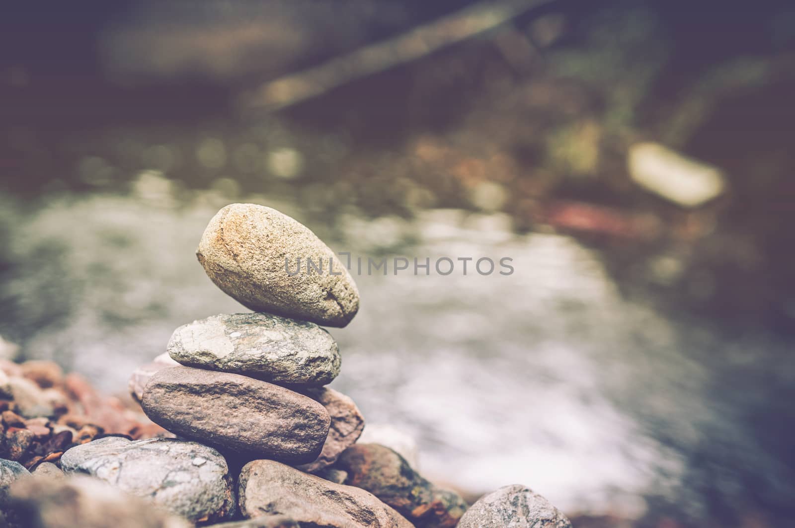 zen basalt stones and waterfall in forest