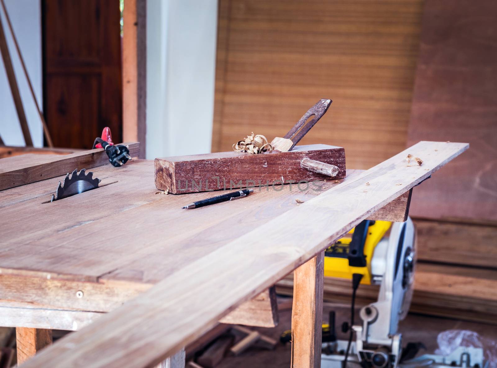 closeup of table and carpenter tool