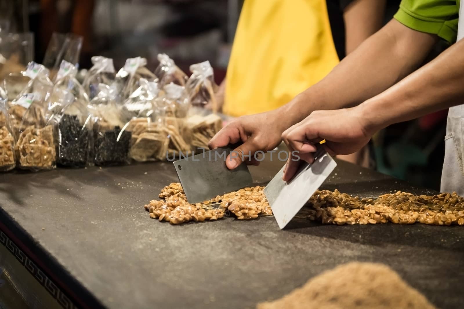 closeup of chef's hand making dessert for sale