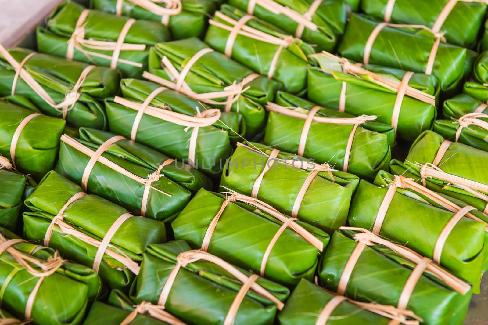 Green background of Khao Tom Mad, dessert food of Thailand culture