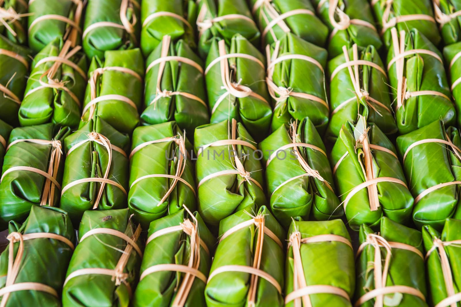Green background of Khao Tom Mad, dessert food of Thailand culture