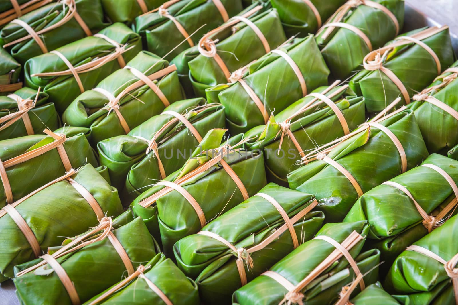 Green background of Khao Tom Mad, dessert food of Thailand culture