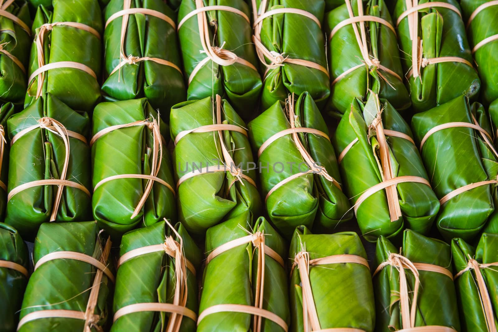 Green background of Khao Tom Mad, dessert food of Thailand culture