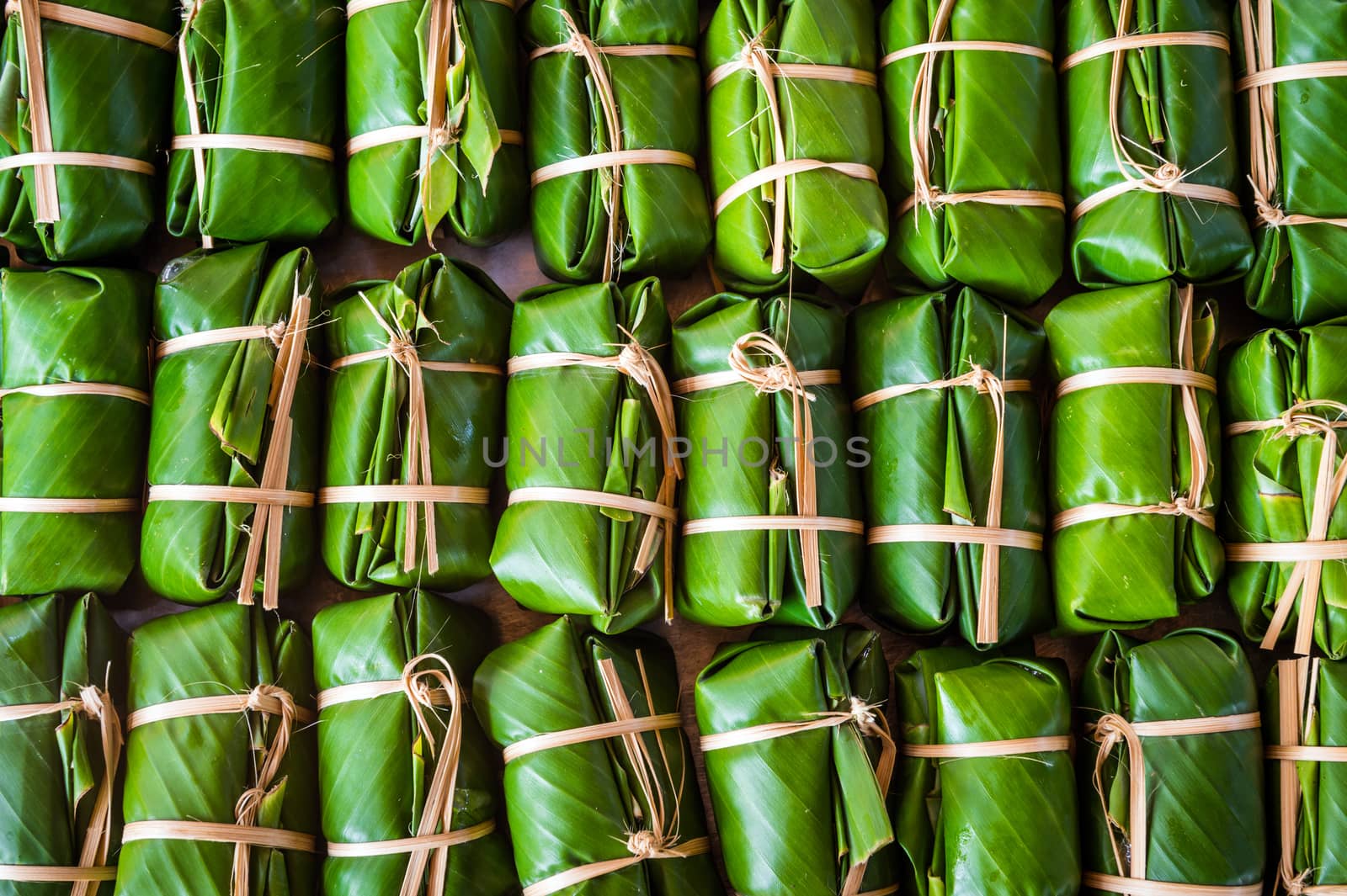 Green background of Khao Tom Mad, dessert food of Thailand culture