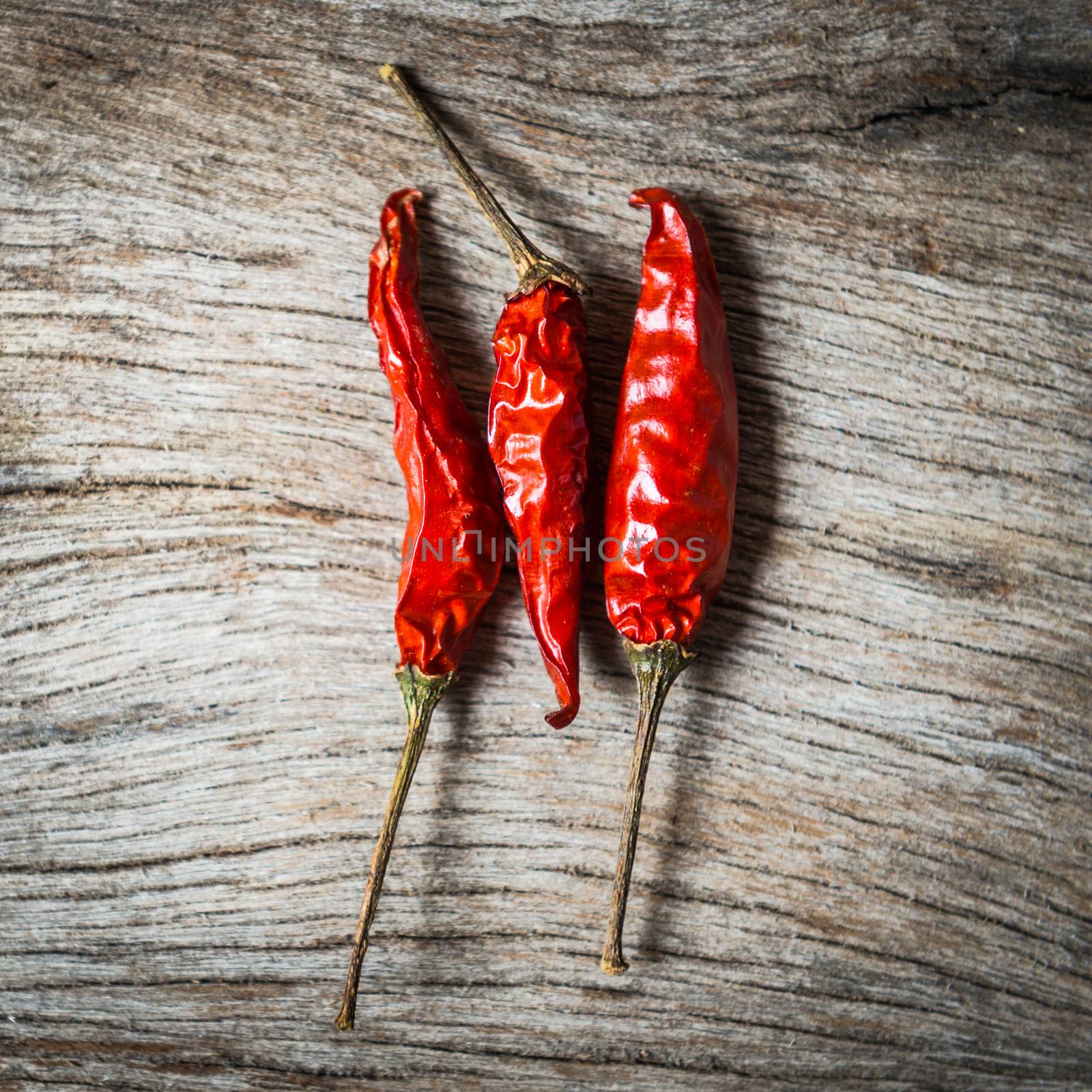 red chilli on wooden background