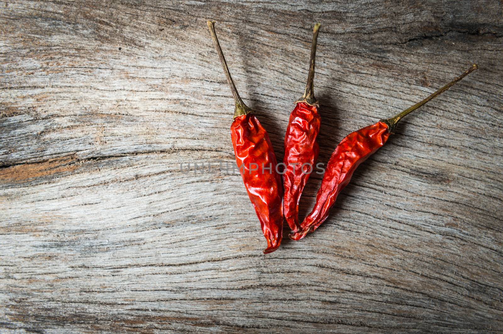 red chilli on wooden background