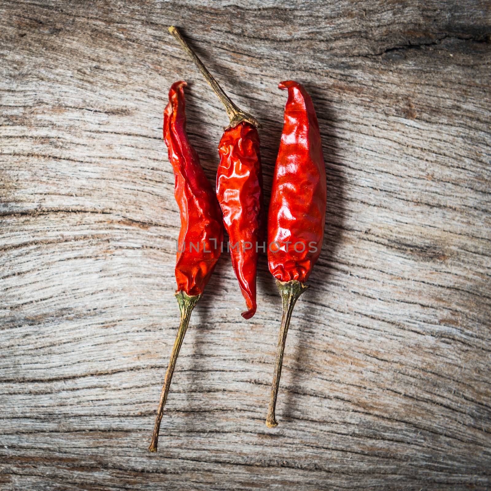 red chilli on wooden background