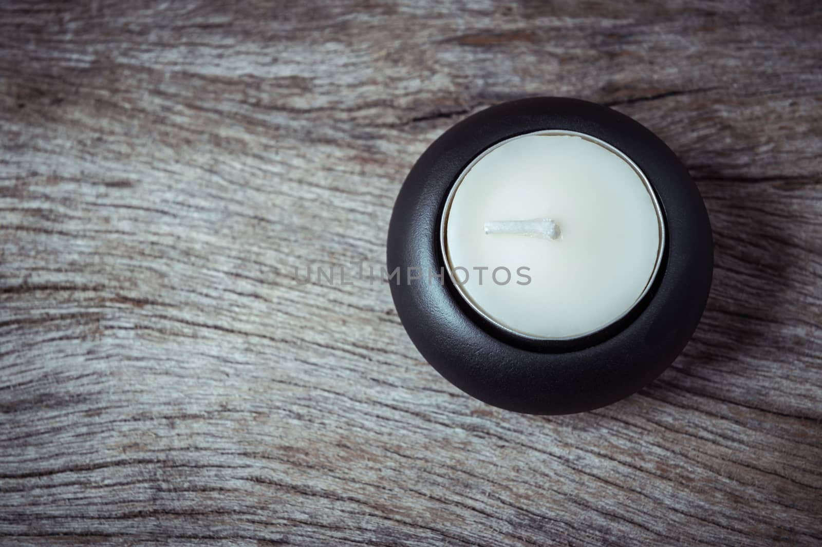 candle light on grunge wood background