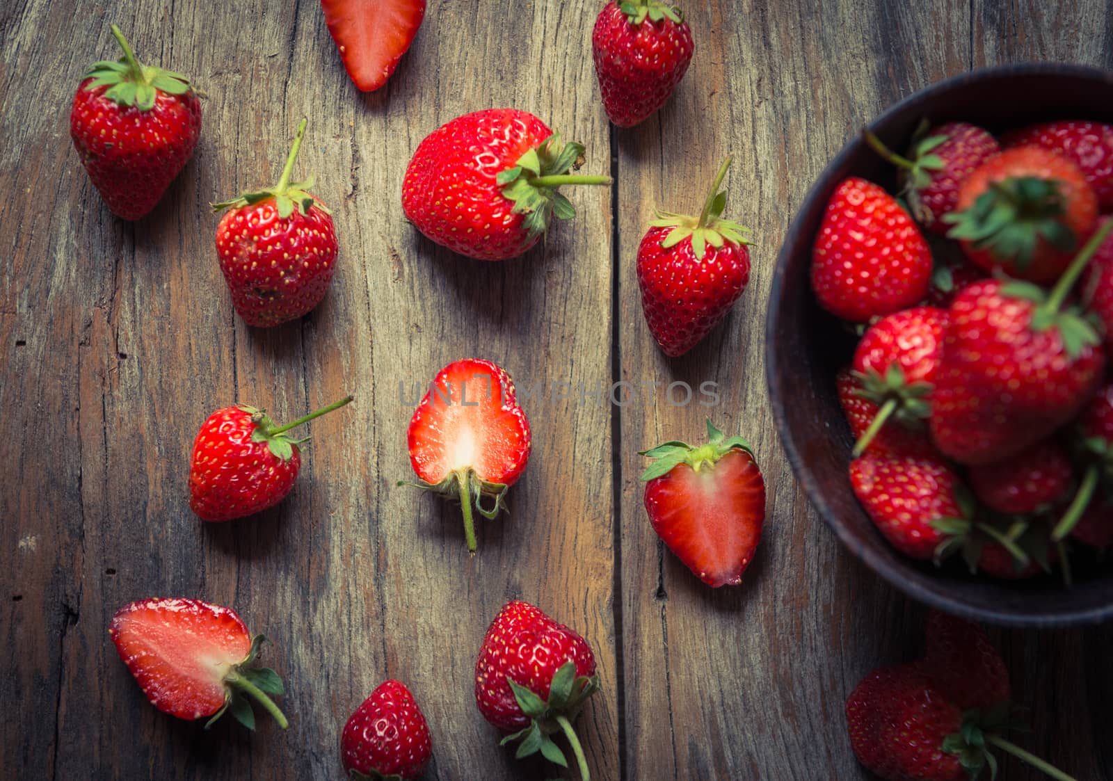 strawberry fruit on grunge wooden background
