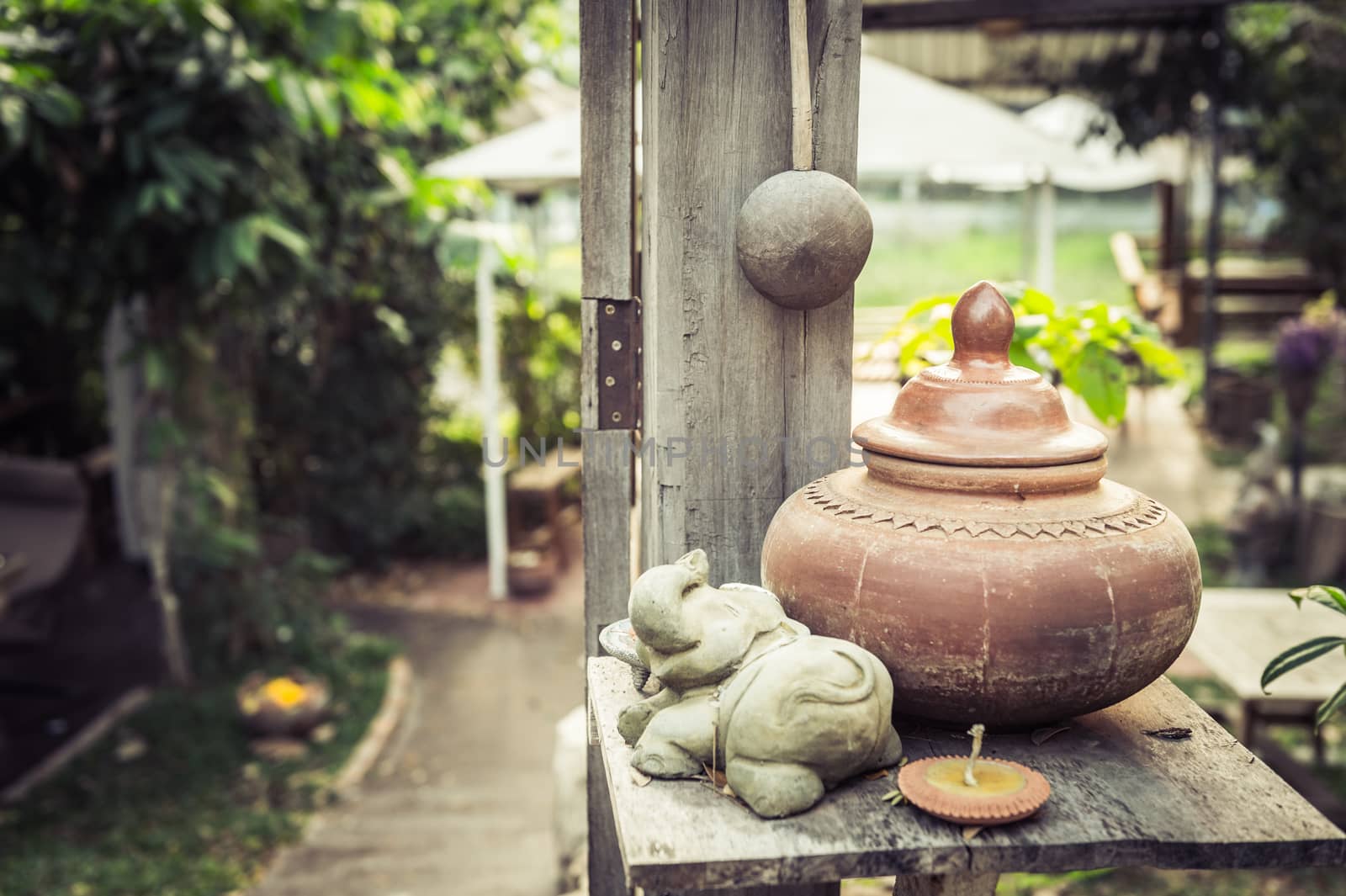 baked clay on wood table, traditional of Thailand