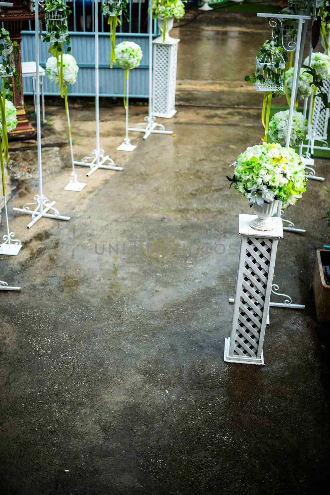 closeup of flower on pillar in wedding entrance