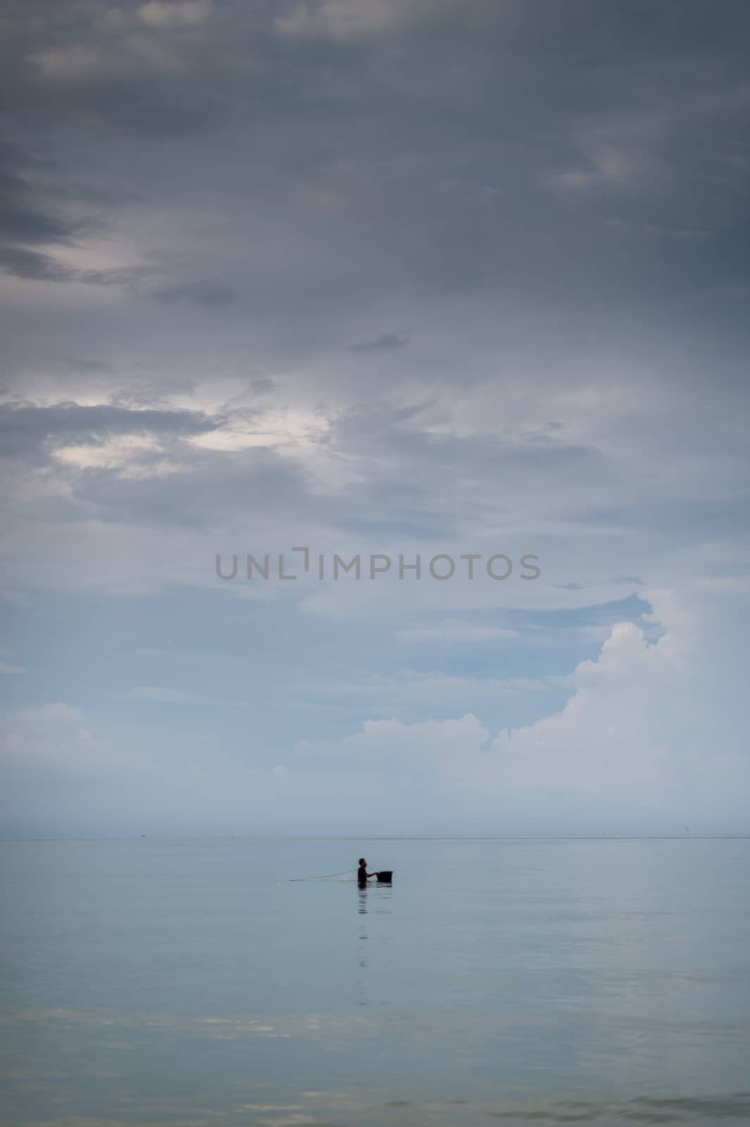 Closeup of fisherman in the sea