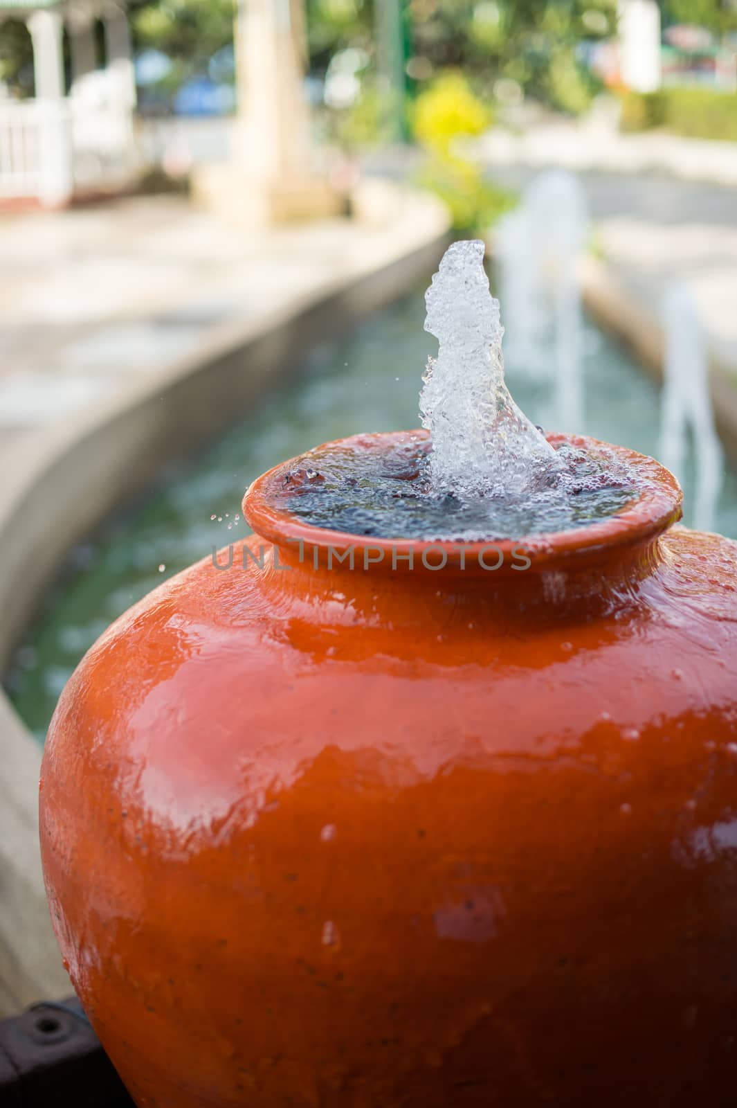 Closeup of water jar fountain