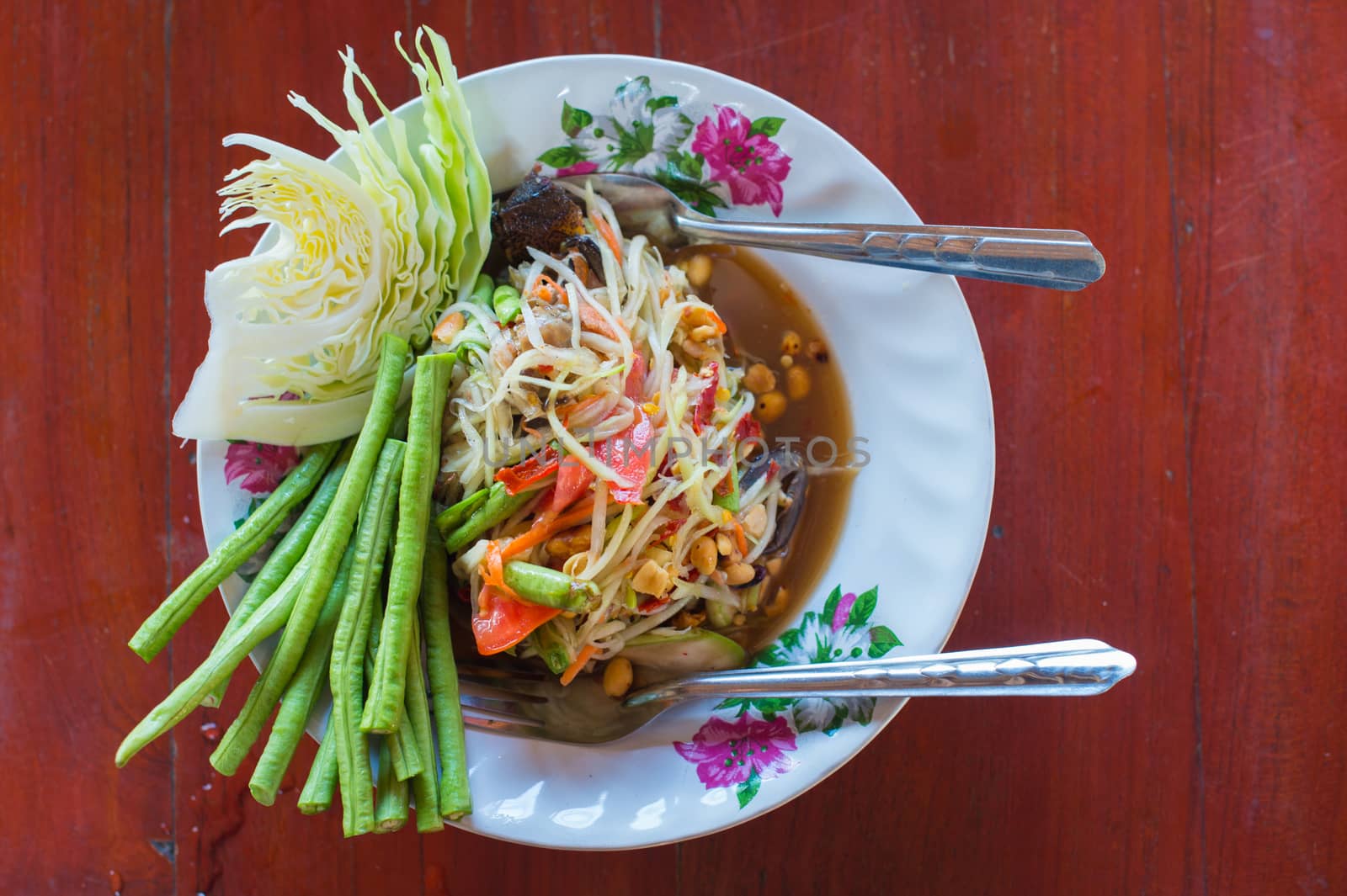 closeup of somtum or green papaya salad by sayhmog