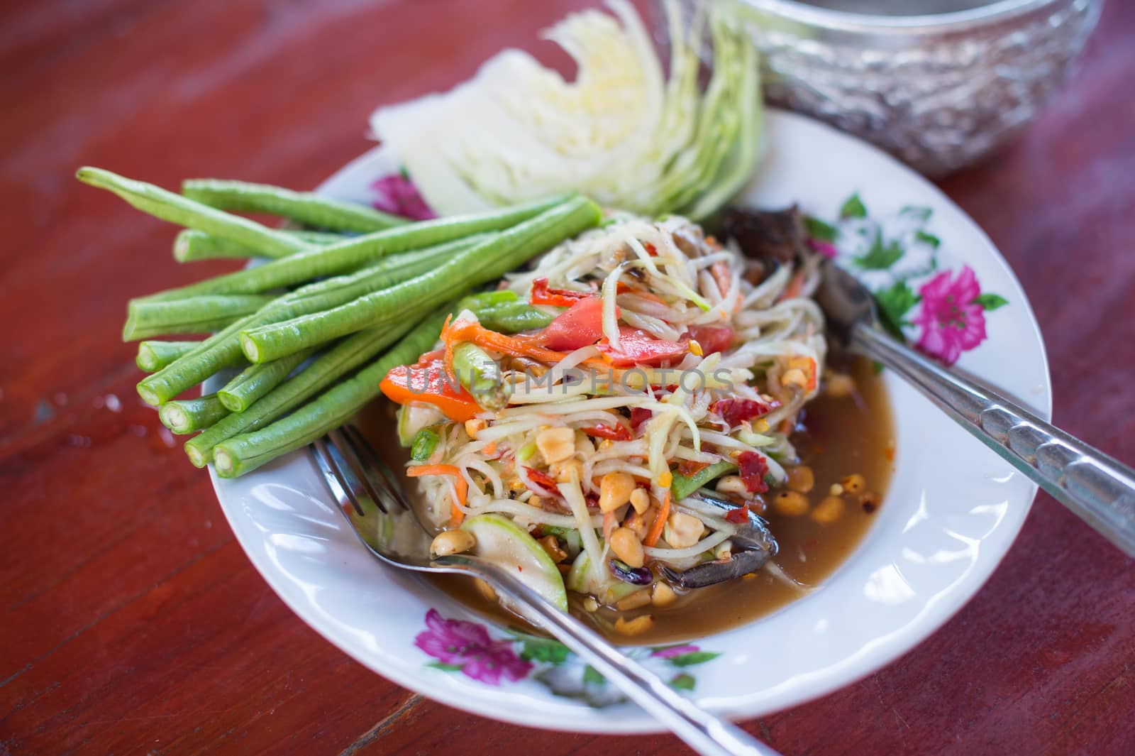 closeup of somtum or green papaya salad by sayhmog