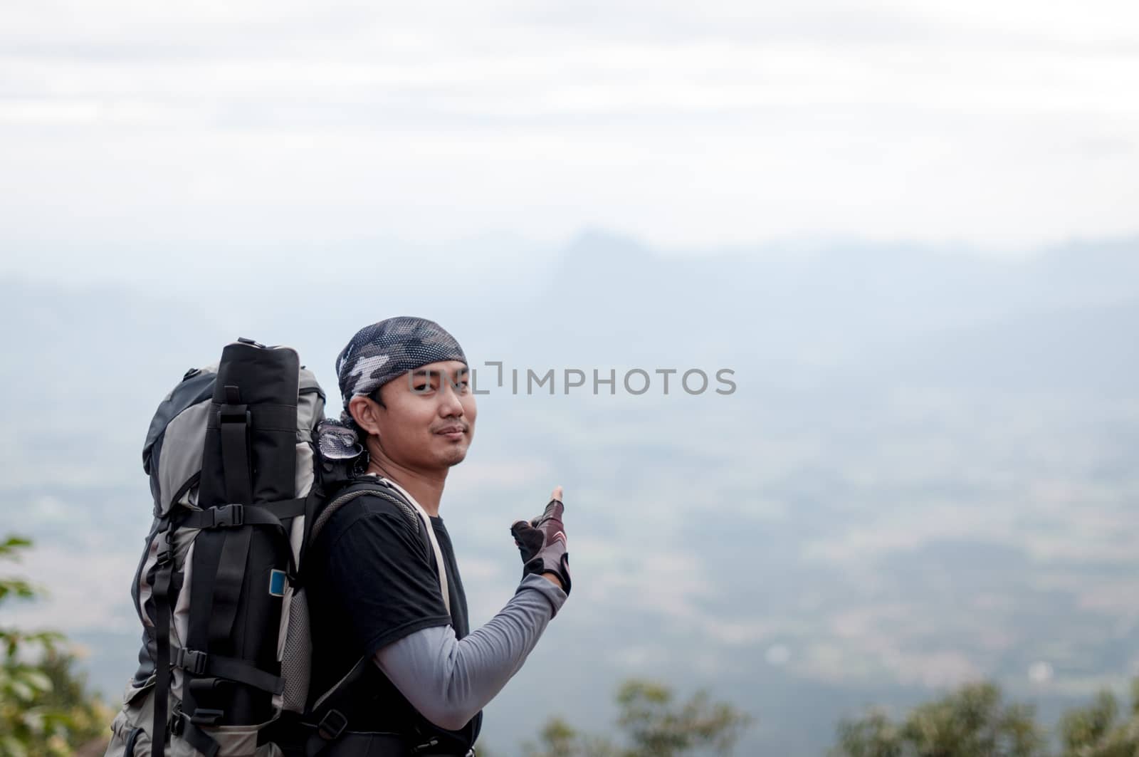 Man traveler portrait with landscape on mountain by sayhmog