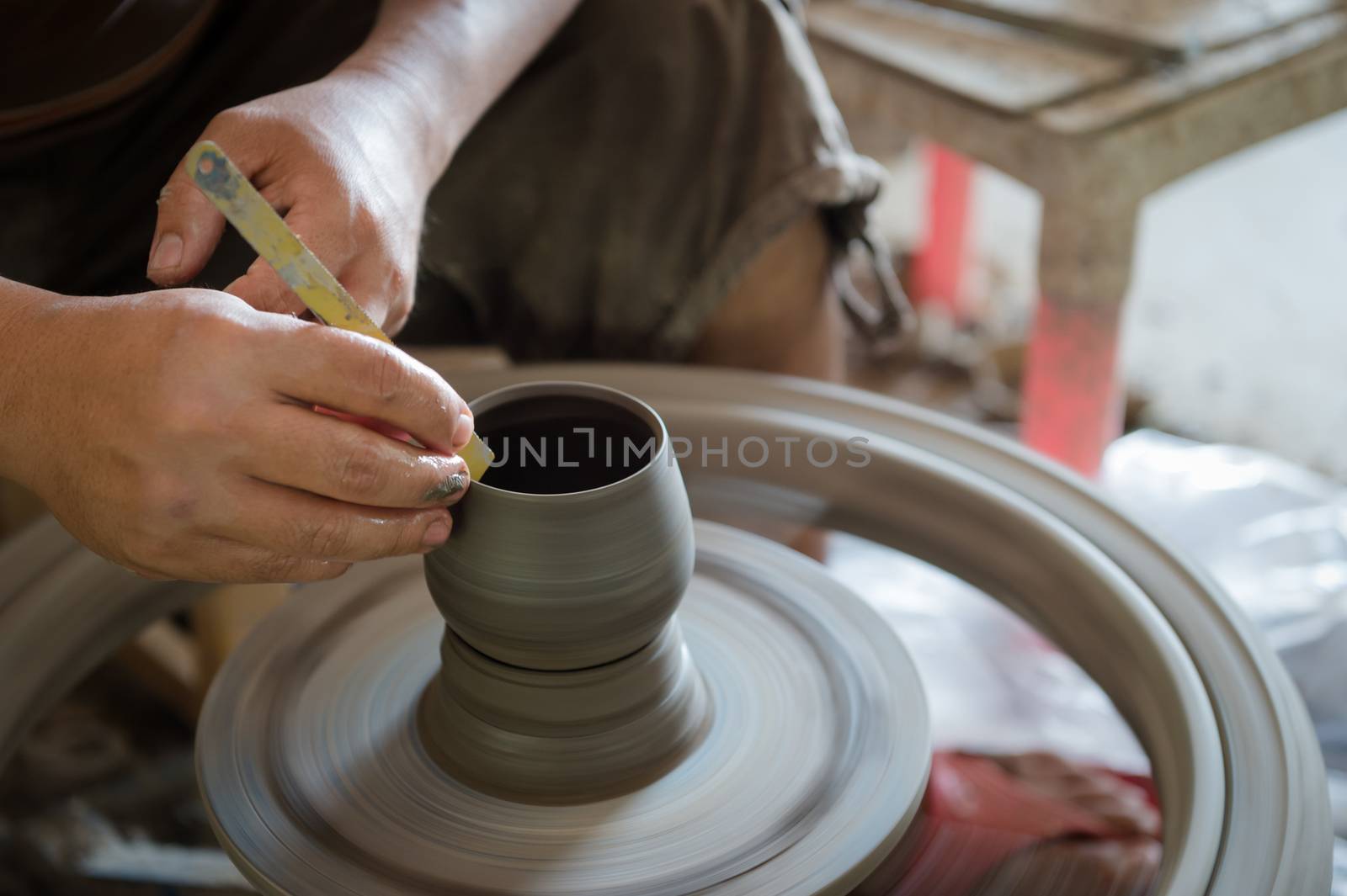 Closeup of sculptor man hand with him job