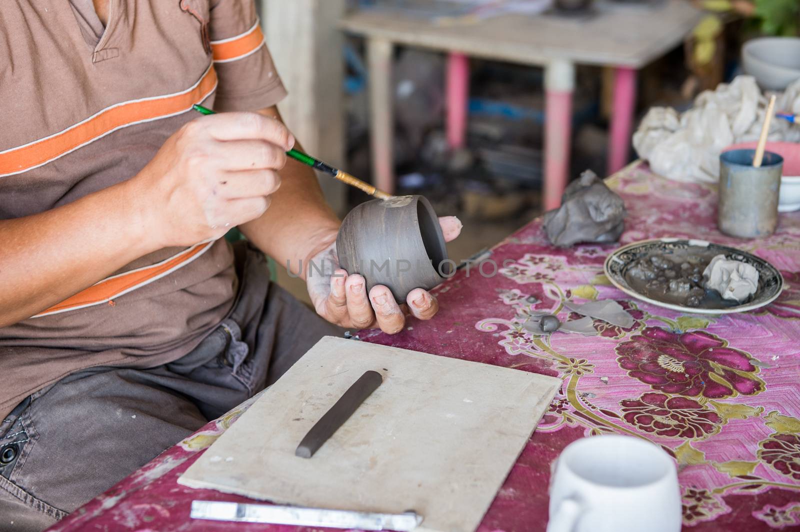 Closeup of sculptor man hand with him job by sayhmog