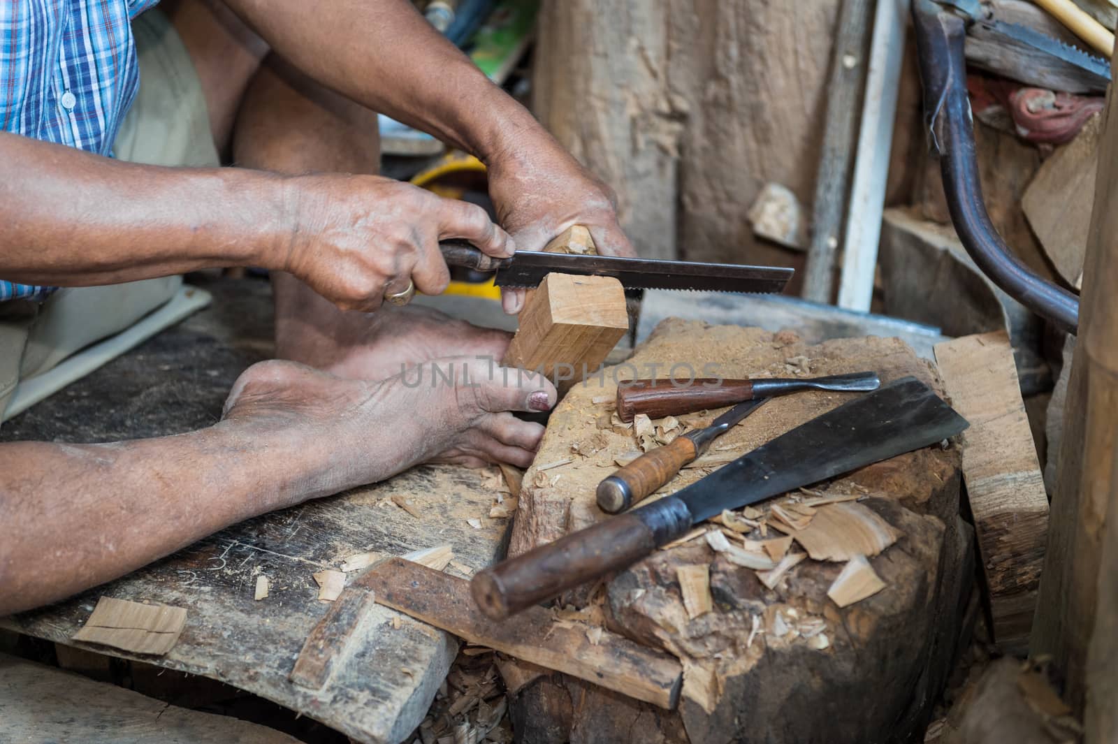 closeup of sculptor man with him job by sayhmog