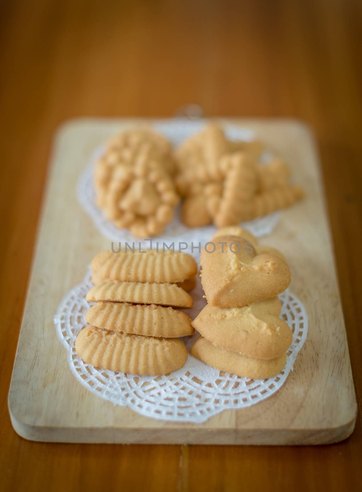 Closeup of cookie on chopping board by sayhmog