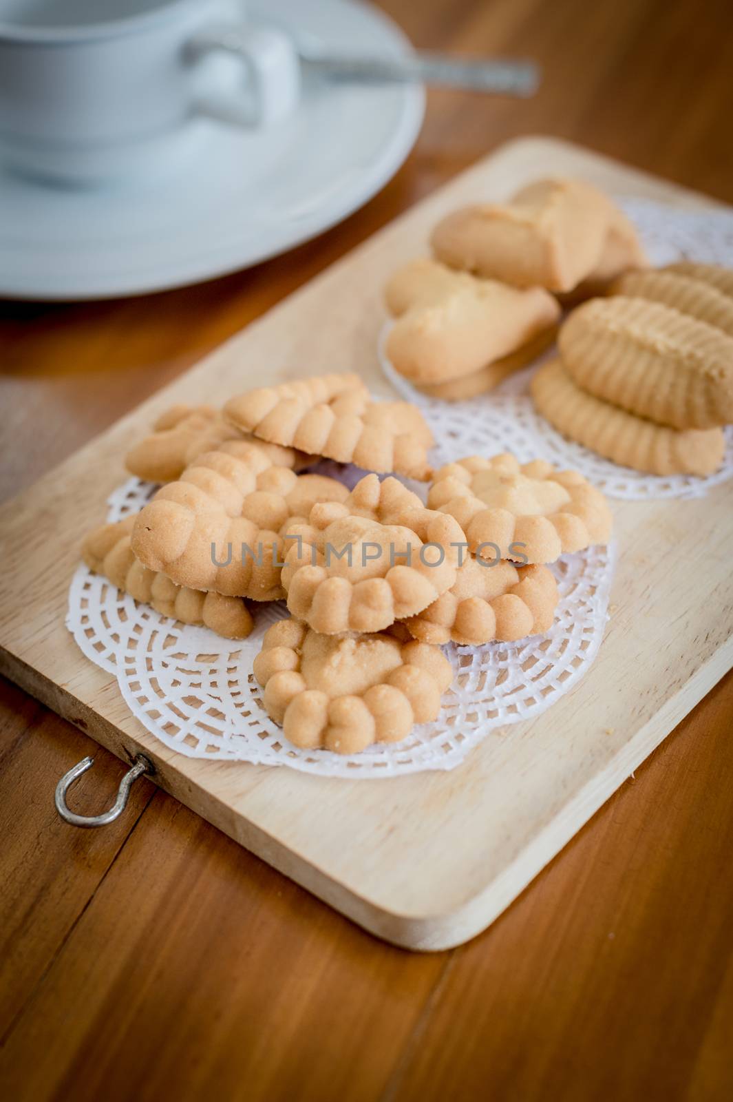 Closeup of cookie on chopping board by sayhmog