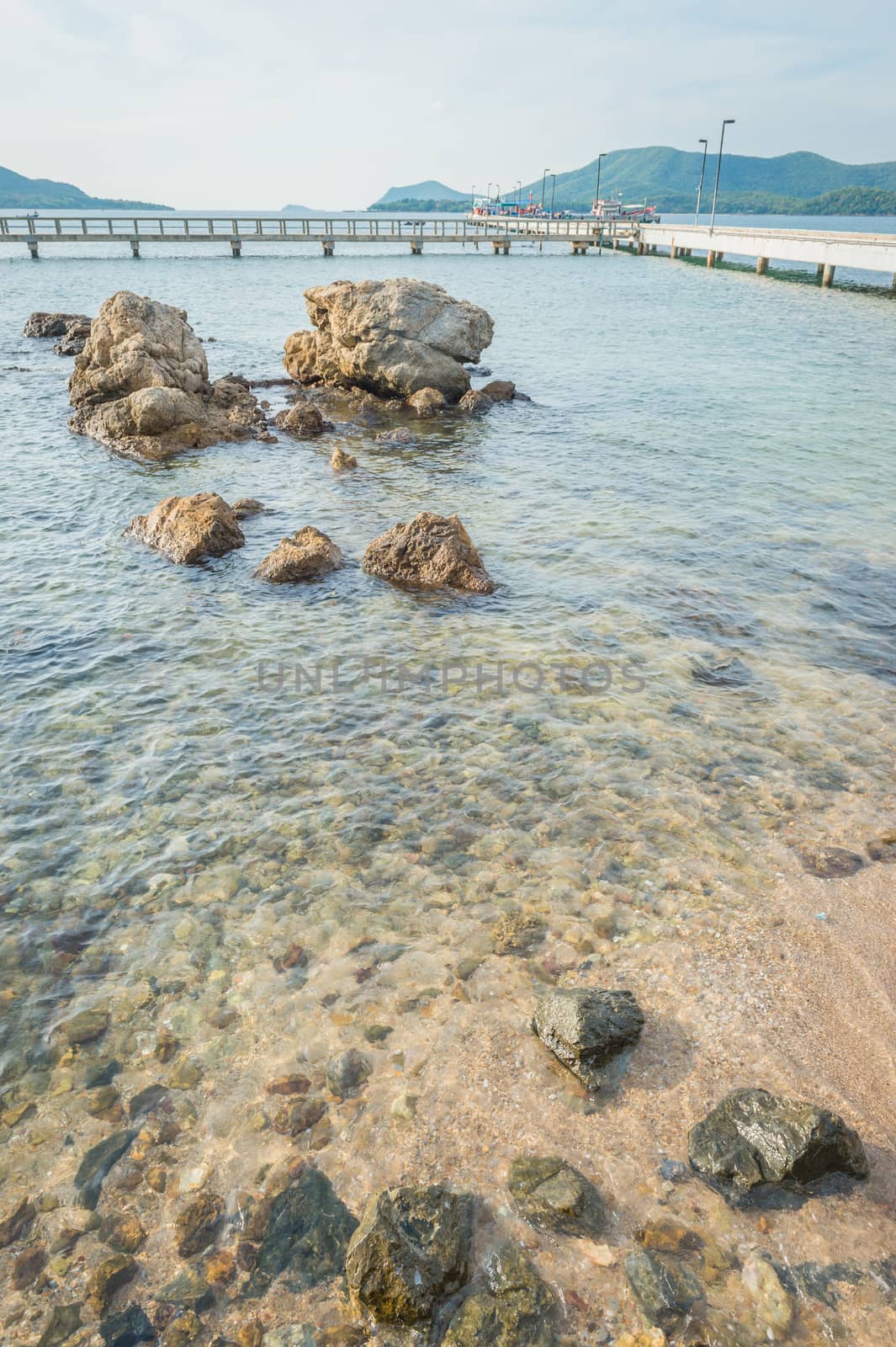 Landscape of rock in the ocean with bridge