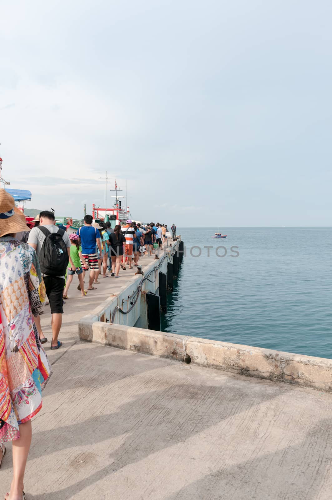 Tourist walking to boat for travel island by sayhmog