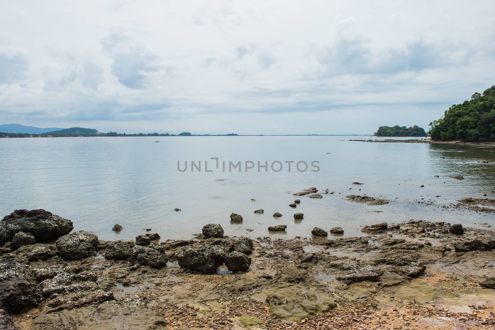 Abstract stone on the beach with mountain landscape by sayhmog