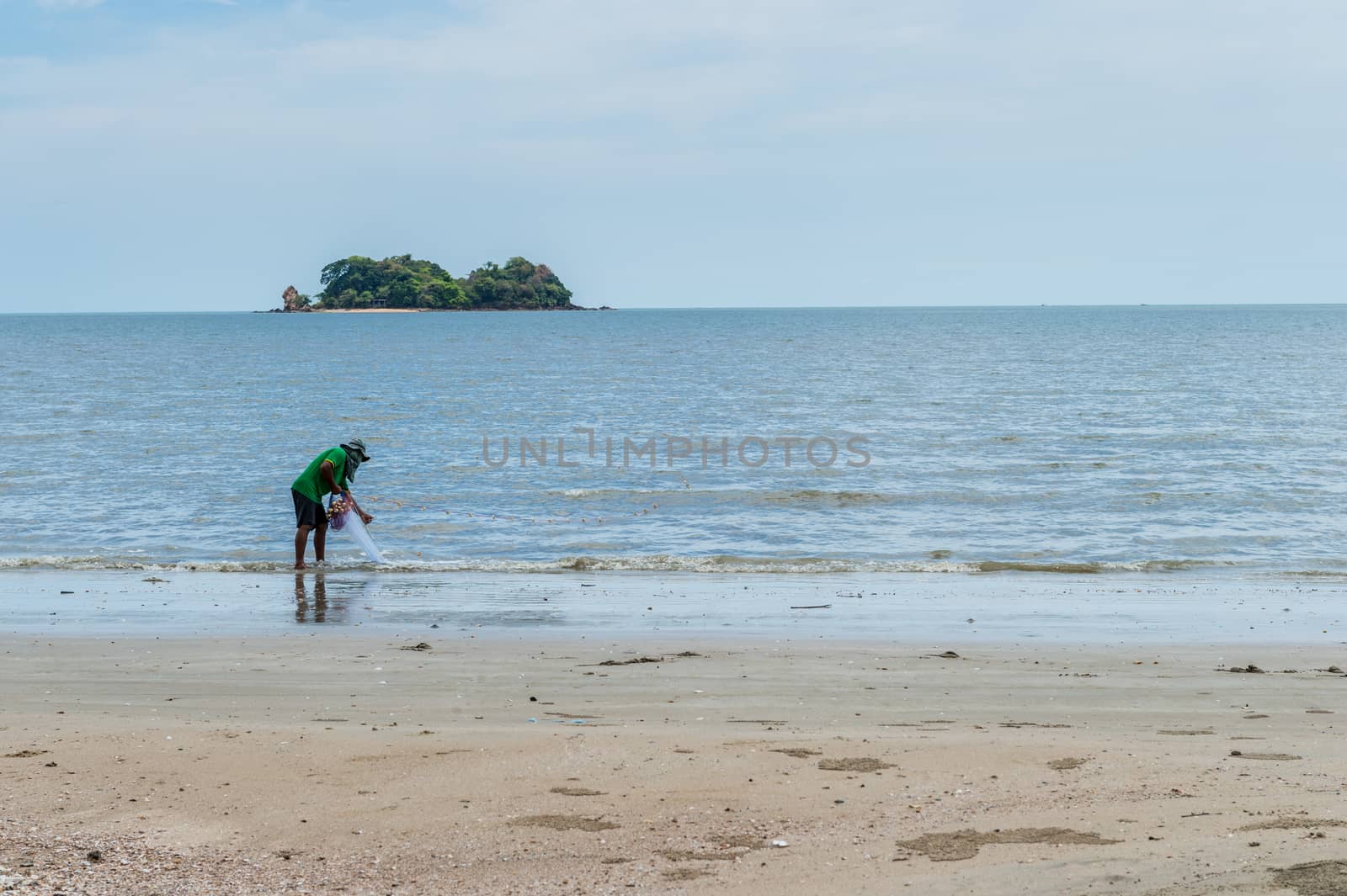 Fisherman with him job on the beach