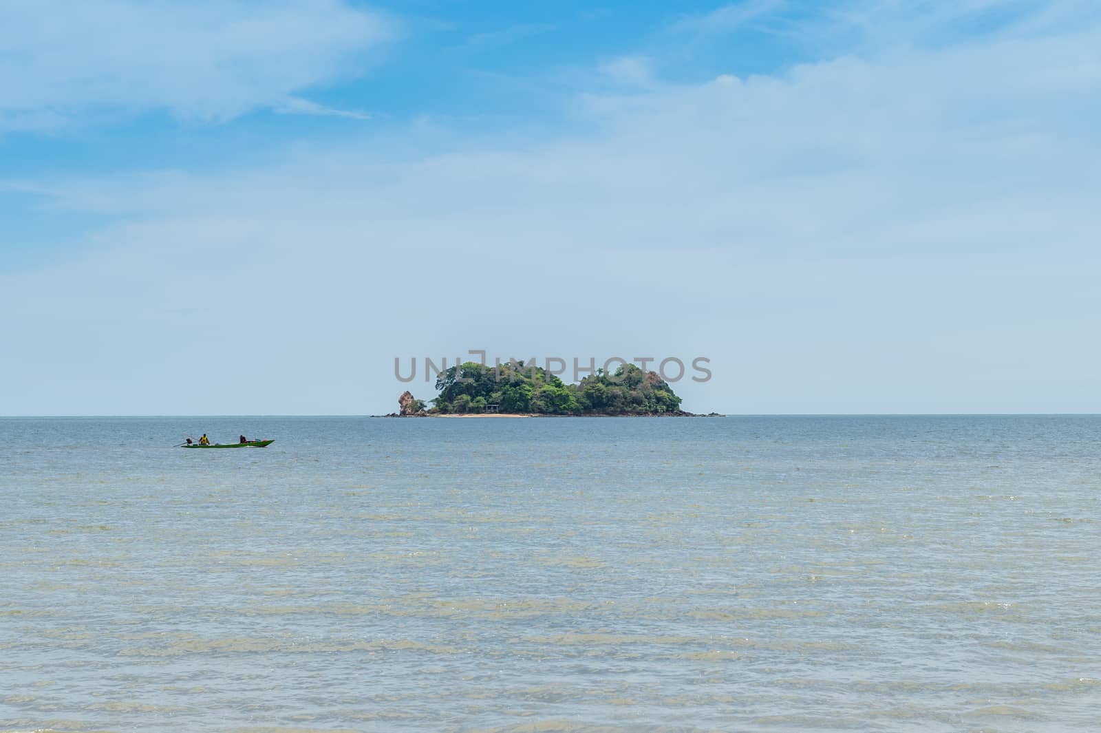 Closeup of island with boat on the ocean