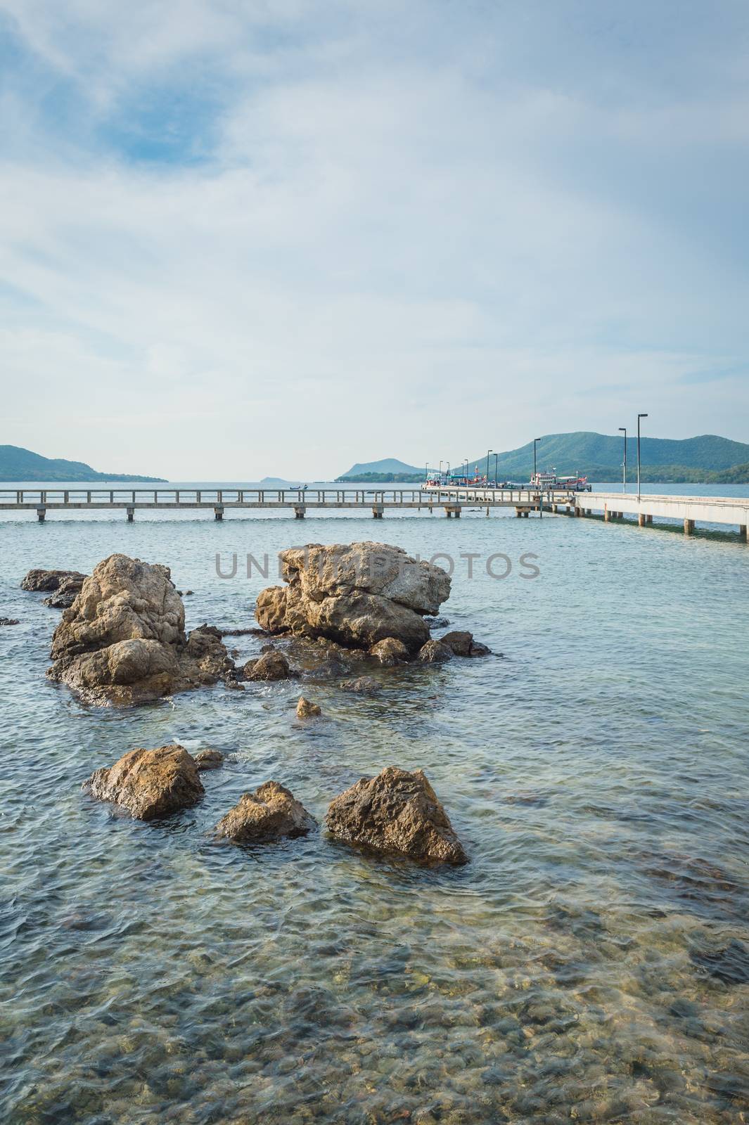 Landscape of rock in the ocean with bridge