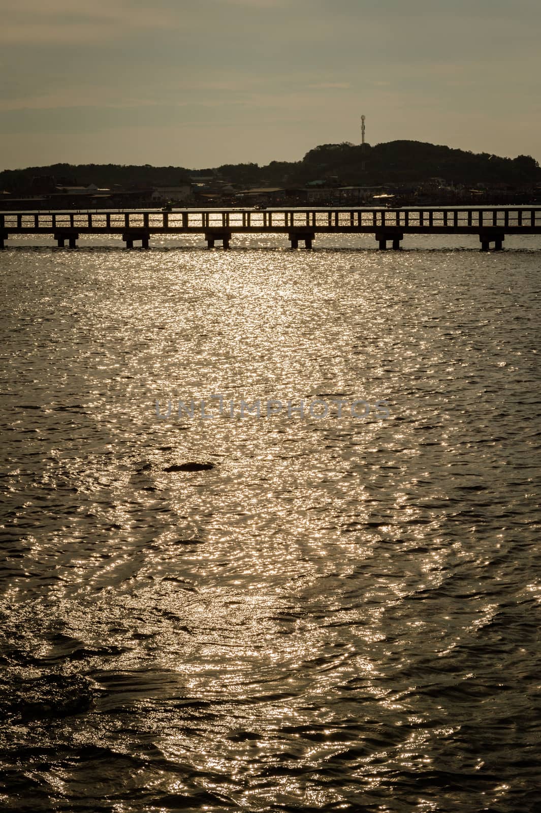 Landscape of sunlight reflection on the sea with bridge  by sayhmog