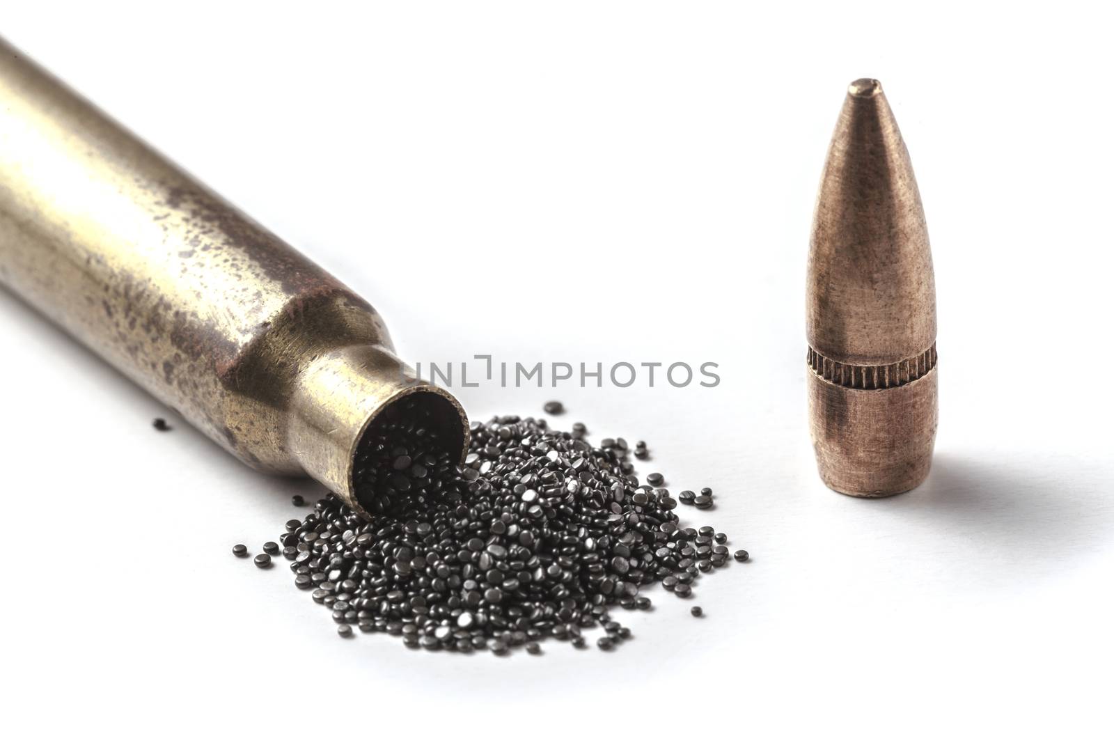 Bullet and gunpowder isolated on white background with shadow