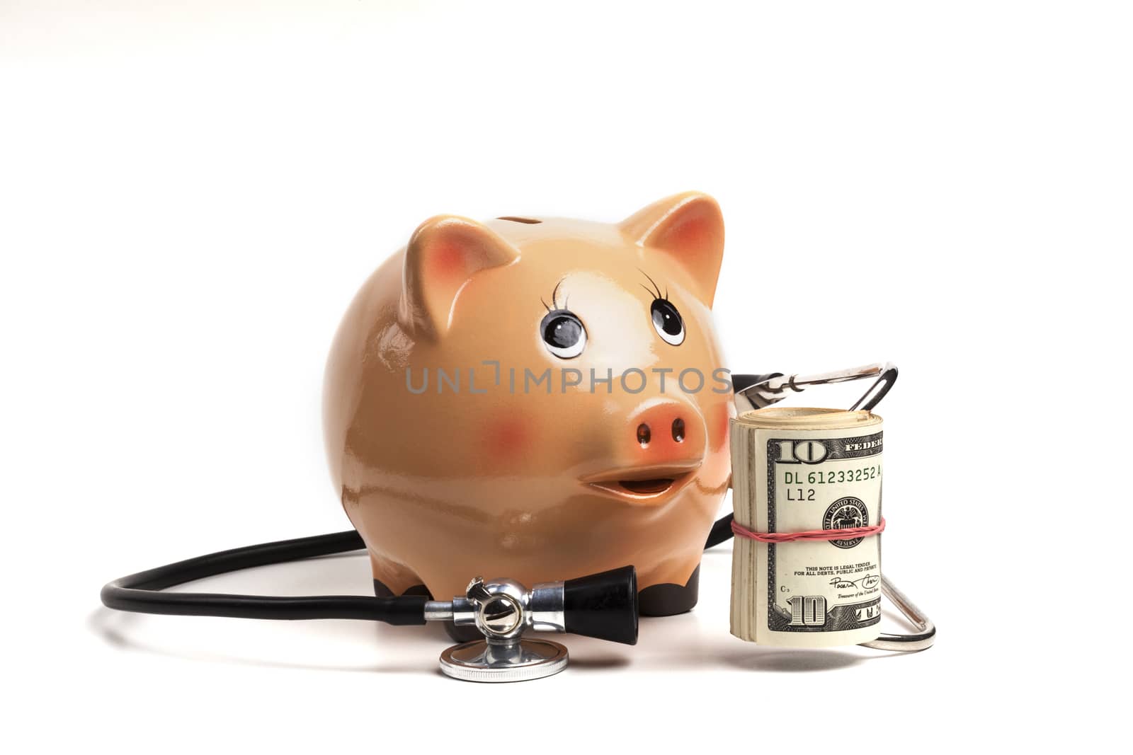 Cute Piggy Bank With Black Stethoscope and Dollars Roll Banknotes Isolated on White Background