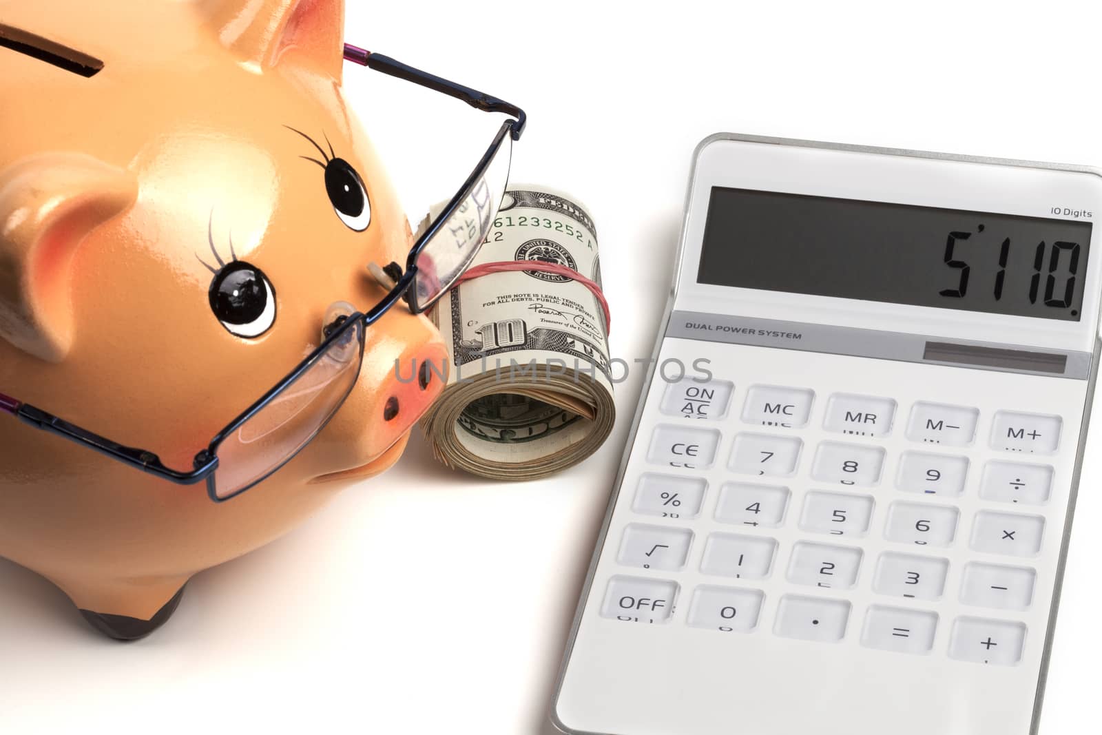 Piggy Bank With Dollars Roll and Calculator Isolated on White Background