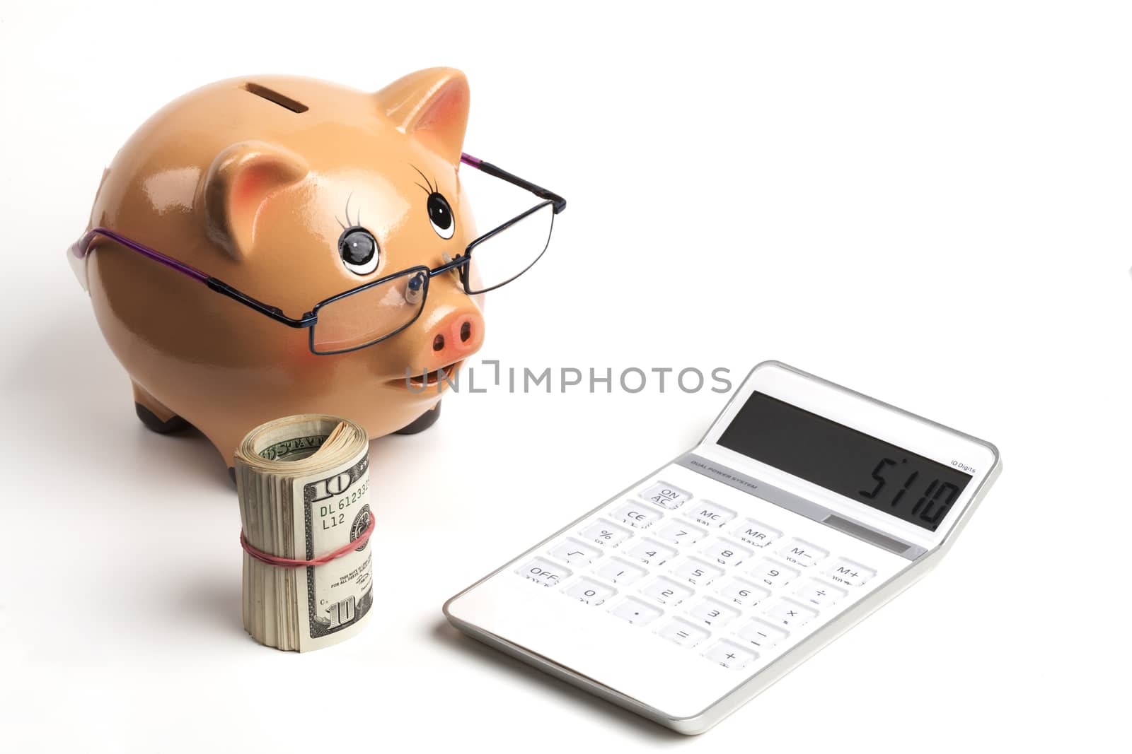 Piggy Bank With Dollars Roll and Calculator Isolated on White Background