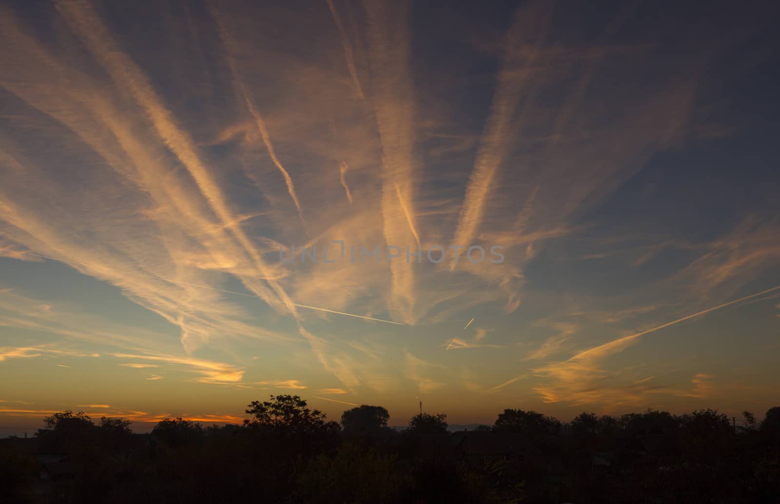 Airplane Trails on Morning Sunrise Cloudy Sky