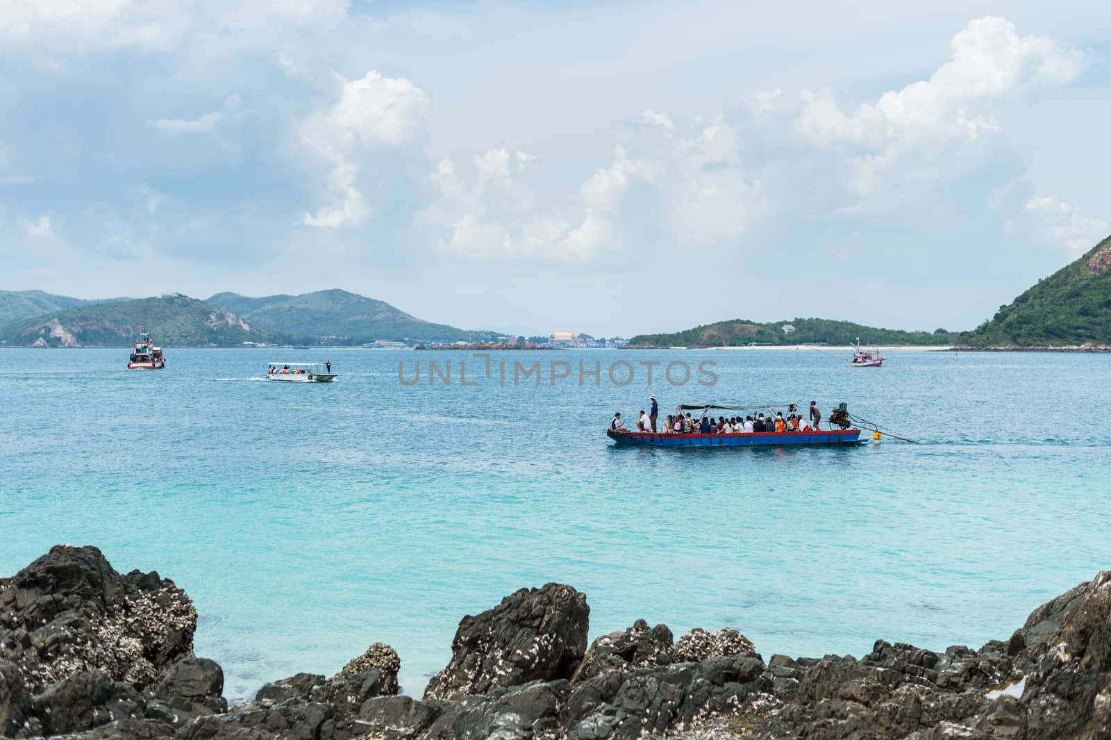 Closeup of boat on the beach with mountain island