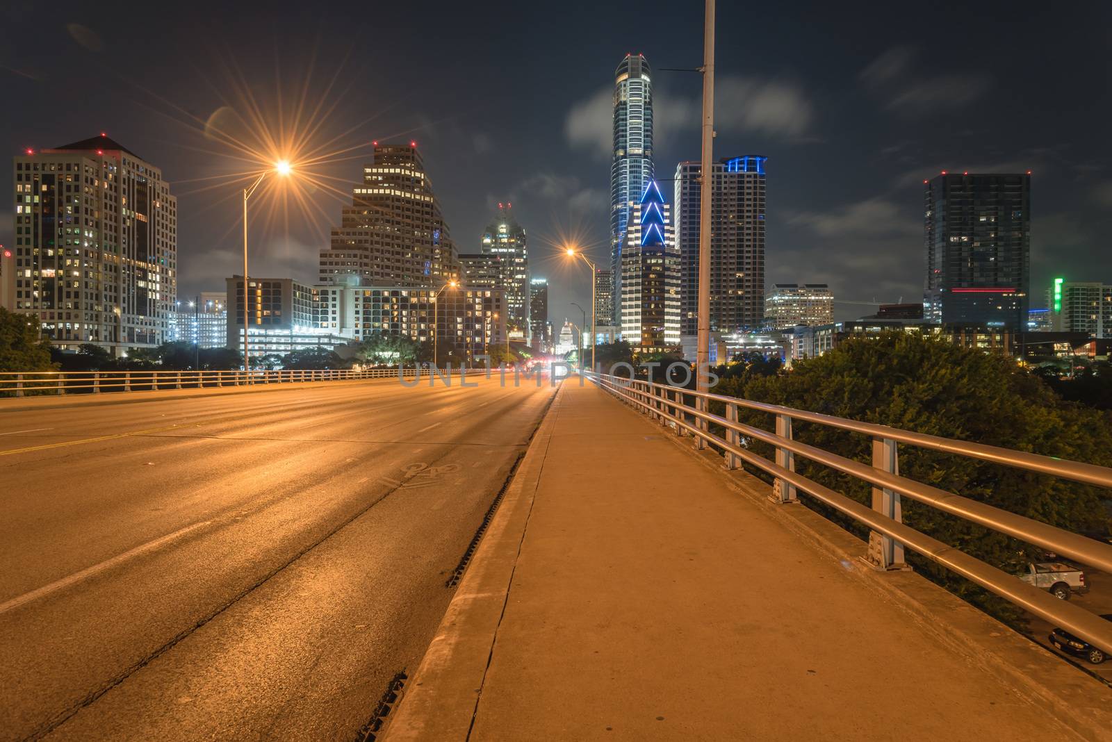 Austin modern skylines and state capitol building at night by trongnguyen