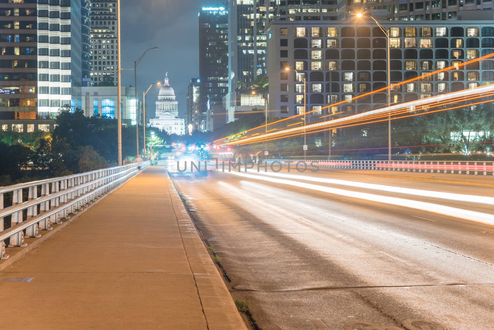 Austin modern skylines and state capitol building at night by trongnguyen